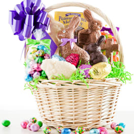 Wicker basket filled with chocolate bunnies and assorted Easter candies