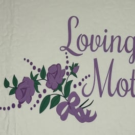 Purple "Loving Mother" text with rose graphics on a quilted white background