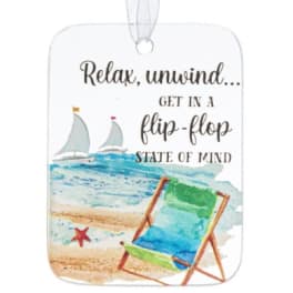 Beach-themed hanging ornament with a chair and sailboats