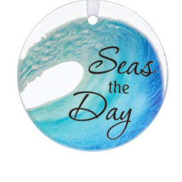 Round hanging ornament with blue wave design and the words Seas the Day