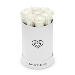 White roses arranged in a round white hat box with a heart logo