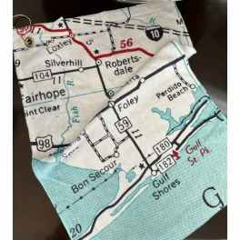 Folded fabric pouch printed with a road map pattern