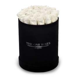 White roses arranged in a black round box