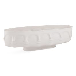 White oval ceramic planter with embossed face motifs