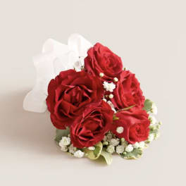 Red rose bouquet with white baby's breath and a white ribbon