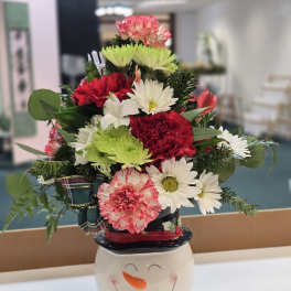 Mixed bouquet in a snowman ceramic container