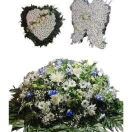 Three white floral funeral sprays, including two heart-shaped tributes and one casket spray