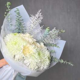 Bouquet of white chrysanthemums and pale roses with eucalyptus