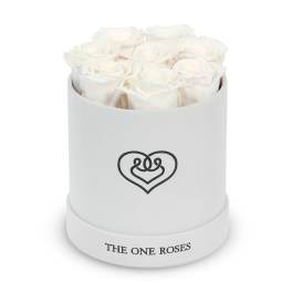 White roses arranged in a round white box with a heart logo