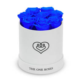 Blue roses arranged in a white round box