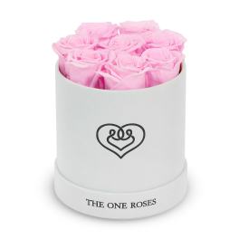 Pink roses arranged in a white round box with a heart logo