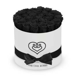 Black roses arranged in a round white box with a black ribbon