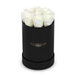 White roses in a black cylindrical box