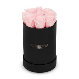 Pink roses arranged in a black cylindrical box