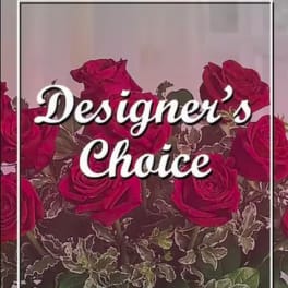 Red roses with variegated foliage and the words "Designer’s Choice"