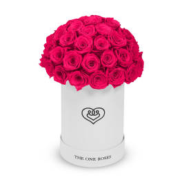 Hot pink roses arranged in a white cylindrical box