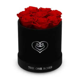 Red roses arranged in a black round box