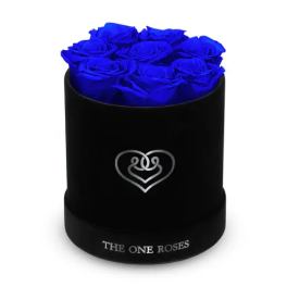 Blue roses arranged in a black round box