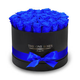 Round box of vivid blue roses with a blue ribbon