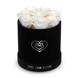 White roses arranged in a black round box