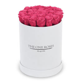 Hot pink roses arranged in a white round box