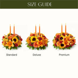 Three autumn floral centerpieces with orange candles labeled standard, deluxe, and premium.