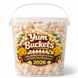 Clear plastic bucket filled with popcorn and a printed label