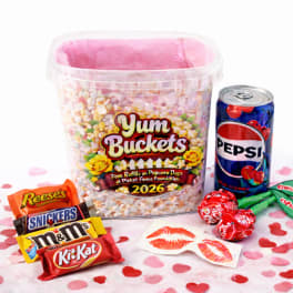 Candy bucket with assorted chocolates and a Pepsi can