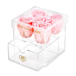Pink roses in a clear acrylic box with a drawer