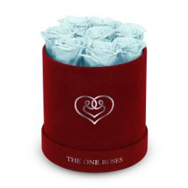 Blue roses in a red round box with a heart emblem