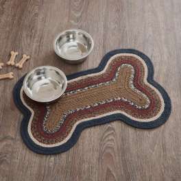 Dog bone-shaped mat with two metal bowls and bone treats