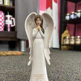 White praying angel figurine with gold trim and folded hands