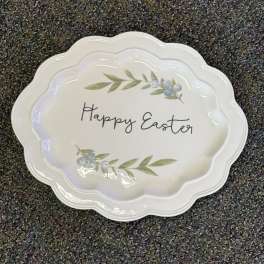 White scalloped plate with "Happy Easter" text and berry sprigs