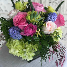 Bouquet of pink, white, green, and blue flowers
