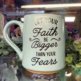 Light blue mug with the phrase "Let your faith be bigger than your fears"