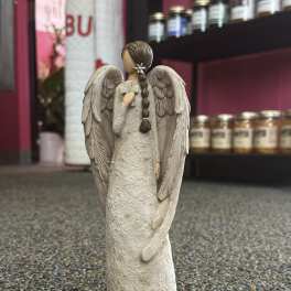 Angel figurine with large wings and braided hair