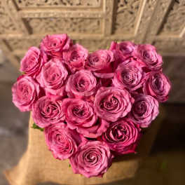 Heart-shaped bouquet of pink roses
