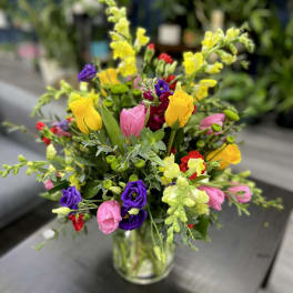 Colorful mixed bouquet in a clear glass vase