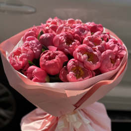 Coral peonies bouquet. The photo shows a deluxe size.
