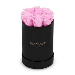 Pink roses in a black cylindrical box