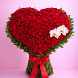 Heart-shaped bouquet of red roses with two white orchids and a red ribbon