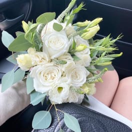 White rose bouquet with pale green accents and eucalyptus