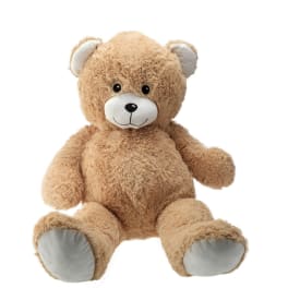 Tan teddy bear plush toy sitting on a white background