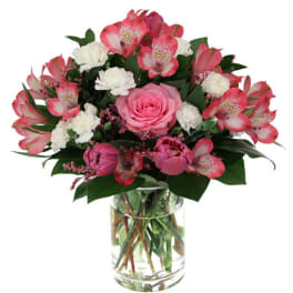 Pink and white mixed bouquet in a clear glass vase