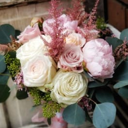 Bouquet of blush and white roses with pink filler and eucalyptus