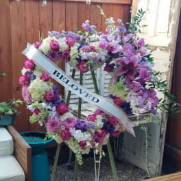 Large floral heart wreath with a "Beloved" ribbon