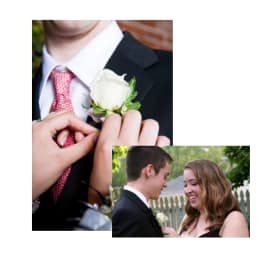 White rose boutonniere being pinned to a suit jacket