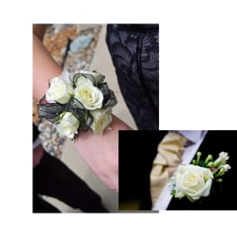 White rose wrist corsage with black ribbon and a white rose boutonniere