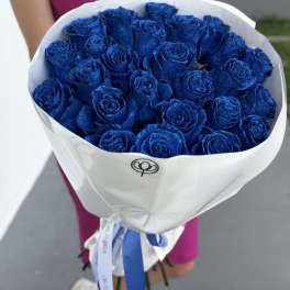 Bouquet of glittery blue roses wrapped in white paper