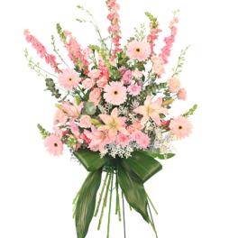 Tall pink floral arrangement with gerbera daisies and lilies